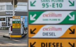 Signs of different kinds of fuel at a Total Energy petrol station in Saint-Leonard. AFP/Sameer Al-Doumy