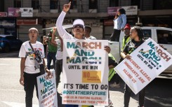 Protesters chant slogans and hold placards at a protest march against undocumented migrants. AFP/Emmanuel Croset