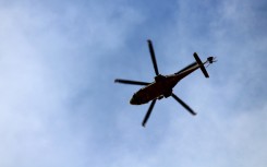 File: A helicopter flying in the sky. GettyImages/Massico Brucci