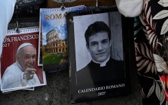 A calendar displaying a picture of Giovanni Galizia dressed as a priest is on sale in a souvenirs shop. AFP/Andreas Solaro