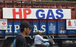 A full delivery truck of HP gas cylinders moves on the street in Kolkata. Sudipta Das/NurPhoto via AFP