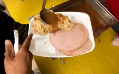 File: A prisoner asking for gravy on his food. James Nielsen/Houston Chronicle via Getty Images