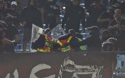  General View of fan being taken by Paramedics after falling during the TotalEnergies CAF Champions League, final 1st leg match between Mamelodi Sundowns and FAR Rabat at Loftus Versfeld Stadium on May 17, 2026 in Pretoria, South Africa. (Photo by Daniel Hlongwane/Gallo Images)