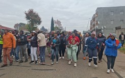 Disgruntled residents of KwaTsaduza want undocumented foreign spaza shop owners arrested.