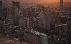 A general view of high-rise buildings of the Johannesburg skyline from the 51th floor of Ponte City, also known as Ponte Tower, in Berea, Johannesburg on May 24, 2024. (Photo by Michele Spatari / AFP)