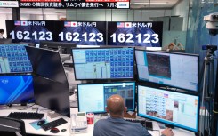 Electronic boards display the foreign exchange rate of the Japanese yen against the US dollar. AFP/Kazuhiro Nogi.jpg