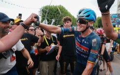 Soudal Quick-Step team's Belgian rider Tim Merlier celebrates after winning the 12th stage of the 113th edition of the Tour de France cycling race, 179,1 km between Circuit de Nevers Magny-Cours and Chalon-sur-Saône in central France, on July 16, 2026. (Photo by Stephanie Lecocq / POOL / AFP)