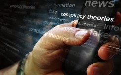 File: Social media on display with conspiracy theories, hoax theory and fake news. GettyImages/Arkadiusz Wargula