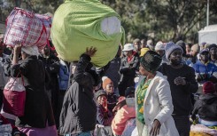 File: A group of Malawian undocumented migrants gather in front of the Malawian Consulate building to prepare for their return home. Ihsaan Haffejee/Anadolu via Getty Images