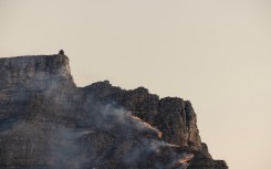 A fire rages on the side of Table Mountain in Cape Town. AFP/Gianluigi Guercia