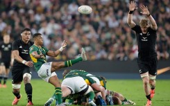 Grant Williams kicks the ball during the Rugby's Greatest Rivalry international rugby union match between South Africa and New Zealand at Ellis Park Stadium. AFP/Phill Magakoe