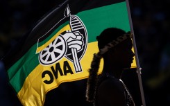 A performer holds an ANC flag while listening to President of the ruling African National Congress (ANC) and South African President, Cyril Ramaphosa speak during the ANC Siyanqoba Rally held at FNB Stadium on May 25, 2024 in Johannesburg, South Africa. South Africa's national and provincial elections will be held on 29 May 2024 to elect a new National Assembly and provincial legislature in each of the nine provinces. (Photo by Chris McGrath/Getty Images)