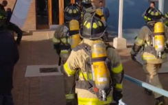 Firefighters on their way into the Madlanga Commission venue. eNCA