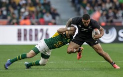 Cobus Reinach tackles New Zealand's hooker Codie Taylor 