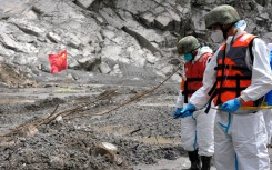An epidemic prevention team disinfects the search area around the destroyed Gyirong Port in Gyirong County. AFP/CNS/China Out