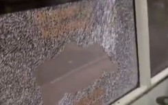 Another video shows a bus with a smashed window. Screenshot