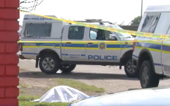 SAPS vehicles at a crime scene