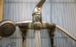 File: Water flows from a tap. Chedly Ben Ibrahim/NurPhoto via AFP