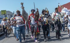 Protestors from the anti-illegal immigration group, March and March Movement chant slogans and march outside the Department of Home Affairs Refugee Reception Centre during a demonstration at the Che Guevara Road in Durban, on October 8, 2026.