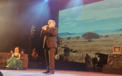 Jannie Moolman on stage singing 