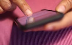 A woman types on an iPhone. Photo: Karl-Josef Hildenbrand/dpa (Photo by Karl-Josef Hildenbrand/picture alliance via Getty Images)