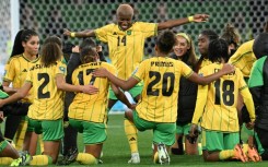Jamaica's players celebrate qualifying for the next round of the Women's World Cup after knocking Brazil out with a 0-0 draw in Melbourne