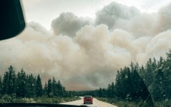 Wildfire smoke engulfing a forest in the northern zone of Canada's Quebec Province in mid July