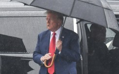 Former US president Donald Trump at Reagan National airport after pleading not guilty to charges of conspiring to overturn the 2020 election