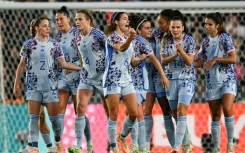 Aitana Bonmati celebrates in front of her teammates after scoring in Spain's rout of Switzerland 