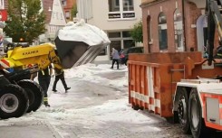 Snow-clearing services deployed in German city of Reutlingen after summer hail