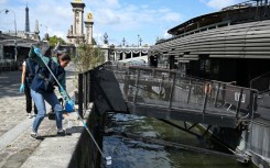 Samples are collected from the Seine ahead of test events for the 2024 Paris Olympics, near the Pont Alexandre III in Paris