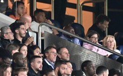 Kylian Mbappe looks on from the stands in Paris Saint-Germain's season opener after being left out over a contract dispute