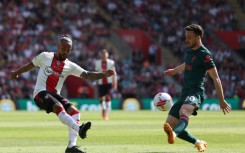 Retired - Southampton forward Theo Walcott (L) 