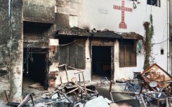 View of a burnt church on the outskirts of Faisalabad, Pakistan following an attack by Muslim men after Christians were accused of blasphemy