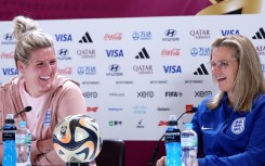 England coach Sarina Wiegman and defender Millie Bright (L) at a press conference ahead of the World Cup final