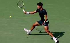 World number one Carlos Alcarez of Spain hits a forehand in his third-round victory over Tommy Paul at the ATP/WTA Cincinnati Open