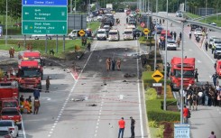 A light plane crashed into a street in the central Malaysian state of Selangor, killing eight people on board and two on the ground, officials say