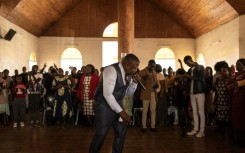 A pastor of the Apostolic Faith Mission addresses the congregation at Harare's Gospel Fire Cathedral