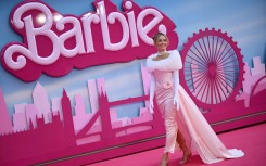Australian actress Margot Robbie poses for a photo during the premier of "Barbie" in London