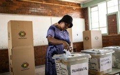 A voter casts her ballot on Thursday -- voting was extended to a second day, purportedly because of delays in printing ballot papers