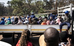 Three dozen local election observers were arrested, crammed into a truck and shipped off to a Harare court