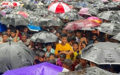 Rohingya refugees gather for a rally marking the sixth anniversary of the violence that drove them from their homes