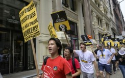Screen Actors Guild members walk a picket line outside of Warner Bros. Discovery on August 10, 2023, in New York City