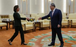 China's Premier Li Qiang (R) greets US Commerce Secretary Gina Raimondo at the Great Hall of the People in Beijing on August 29, 2023.