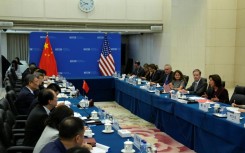 US Commerce Secretary Gina Raimondo (R) met with Chinese Minister of Commerce Wang Wentao (centre-L) in Beijing on Monday