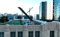 Workers install a large X on the roof of the former Twitter headquarters on July 28, 2023 in San Francisco