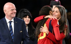Gianni Infantino watches as Spain's Queen Letizia embraces Spain's Salma Paralluelo after the World Cup final 