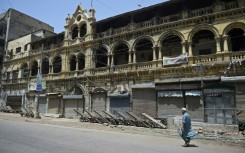 Closed shops along a street in Karachi