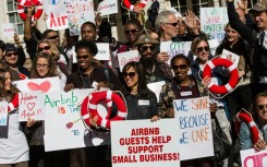 Supporters of Airbnb gather in front of New York City Hall on October 30, 2023, to protest the new legal hurdles for short-term rentals 