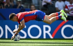 Chile fly-half Rodrigo Fernandez dives to score the World Cup debutants first try to take a shock lead over Japan